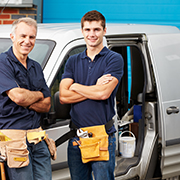 Two builders with tool belts